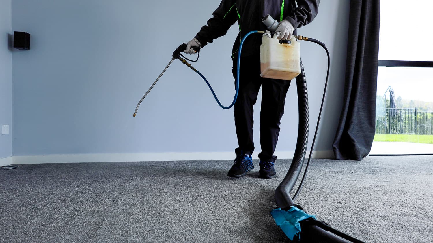 Team Member Spraying the carpet