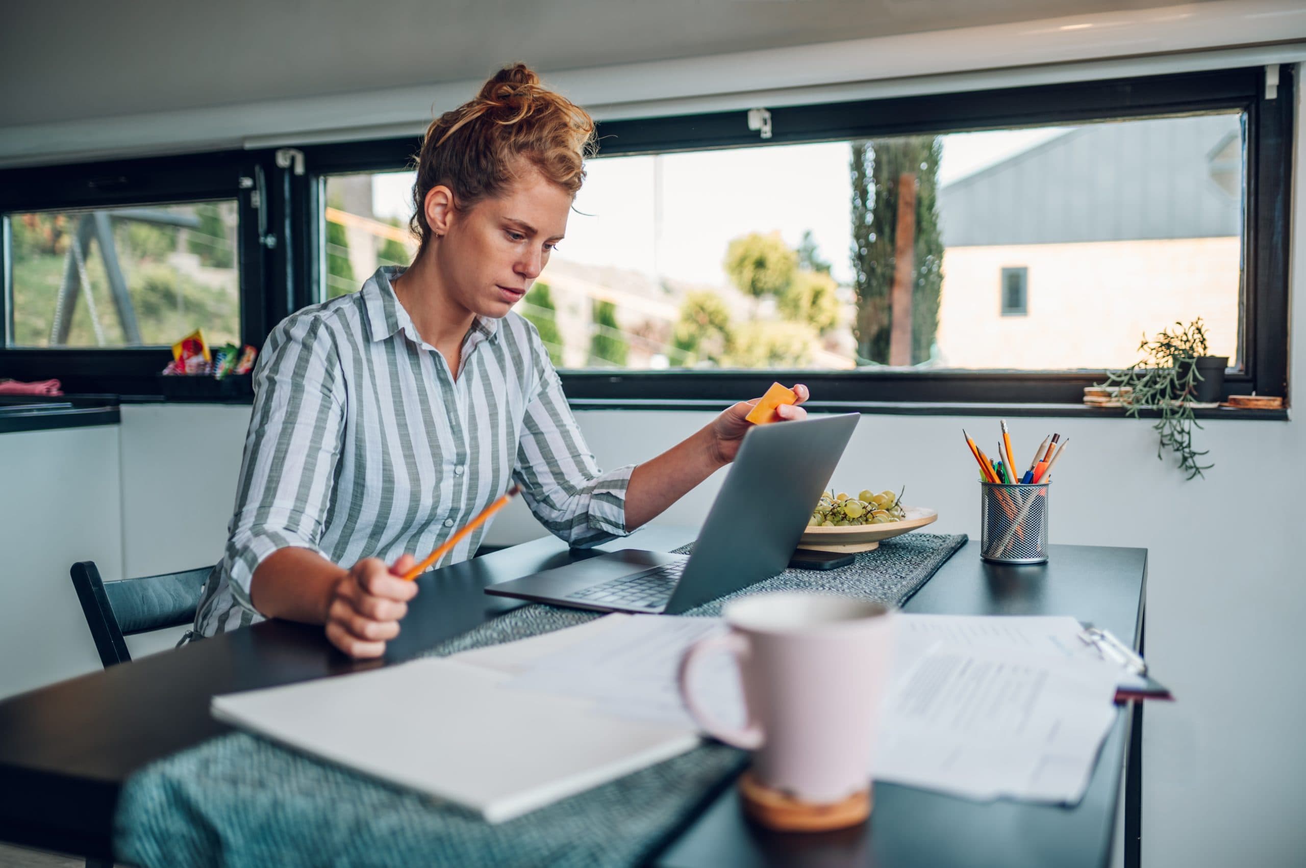 https://cms.epiccleaning.co.nz/wp-content/uploads/2025/05/young-woman-working-in-the-kitchen-at-home-with-la-2025-04-01-13-07-55-utc-scaled.jpg
